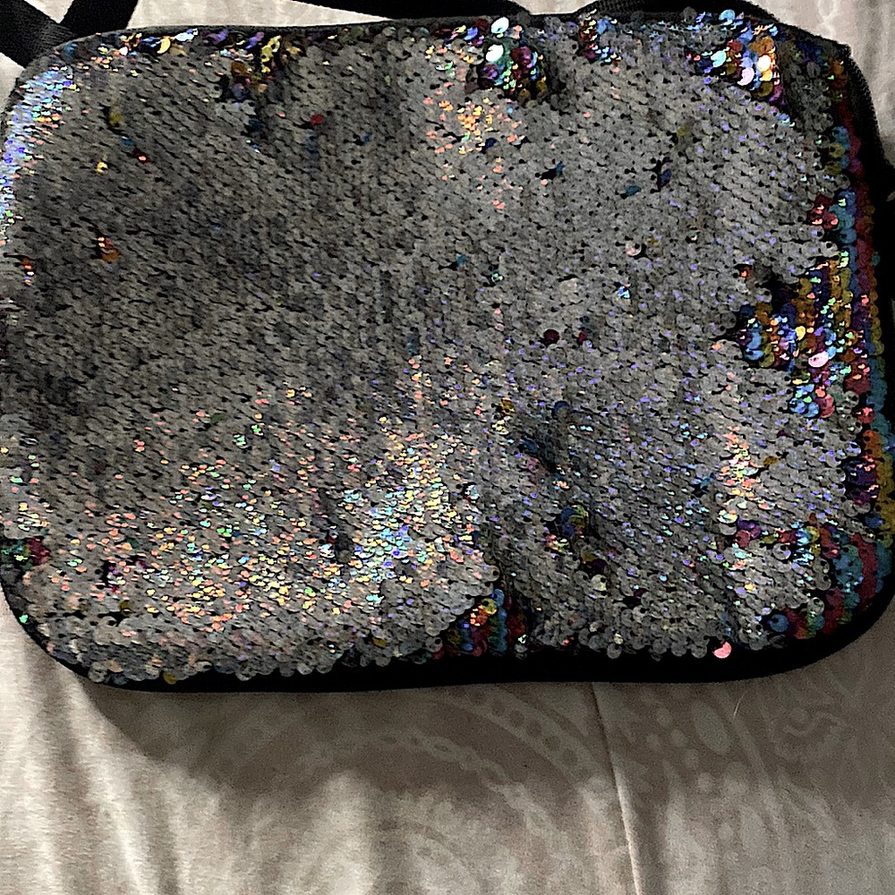It is sequence and rainbow and silver it is a little cute dress up back